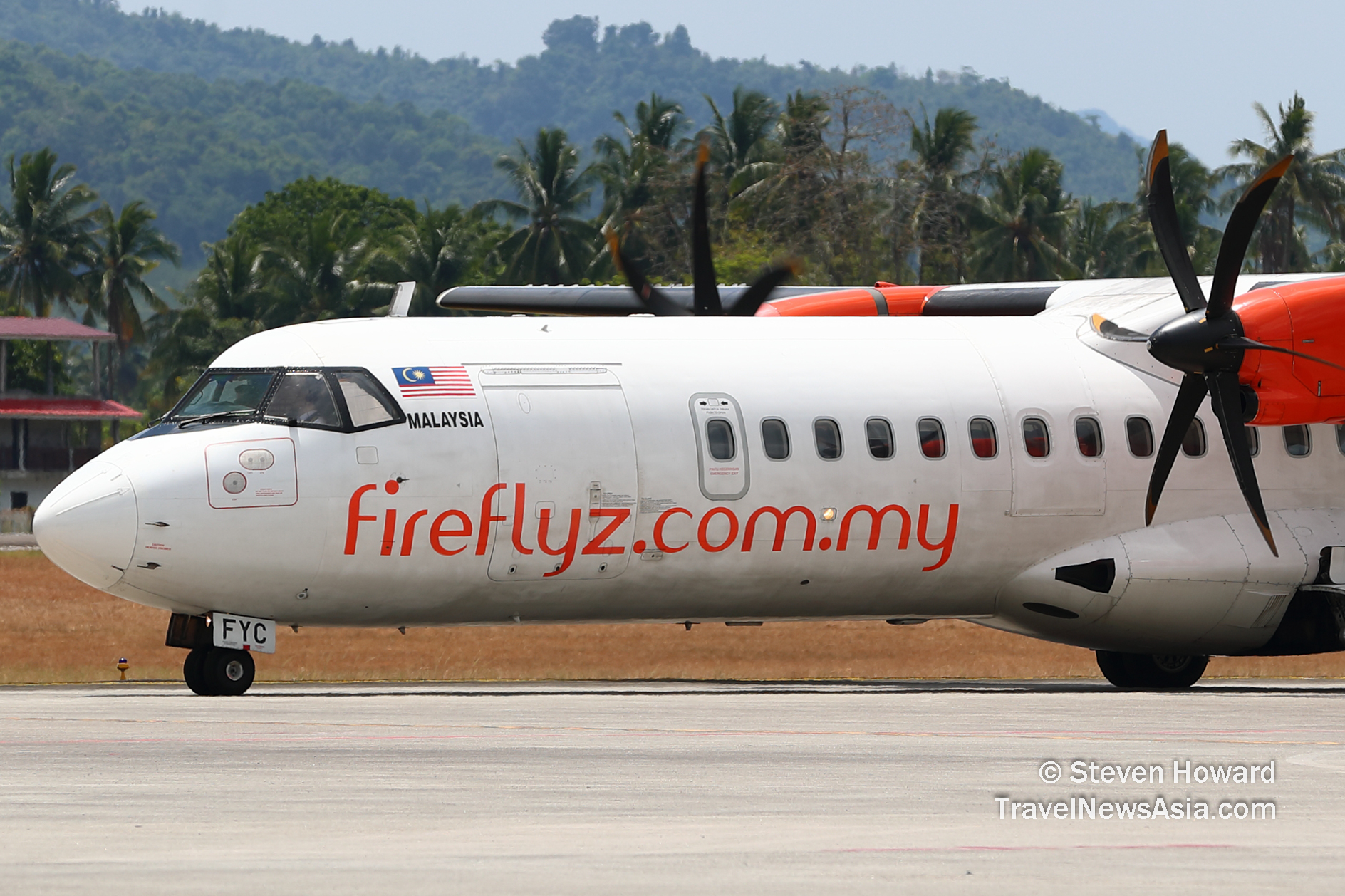 Firefly ATR 72-500 reg: 9M-FYC at Langkawi Airport (LGK) in Malaysia. Picture by Steven Howard of TravelNewsAsia.com Click to enlarge.