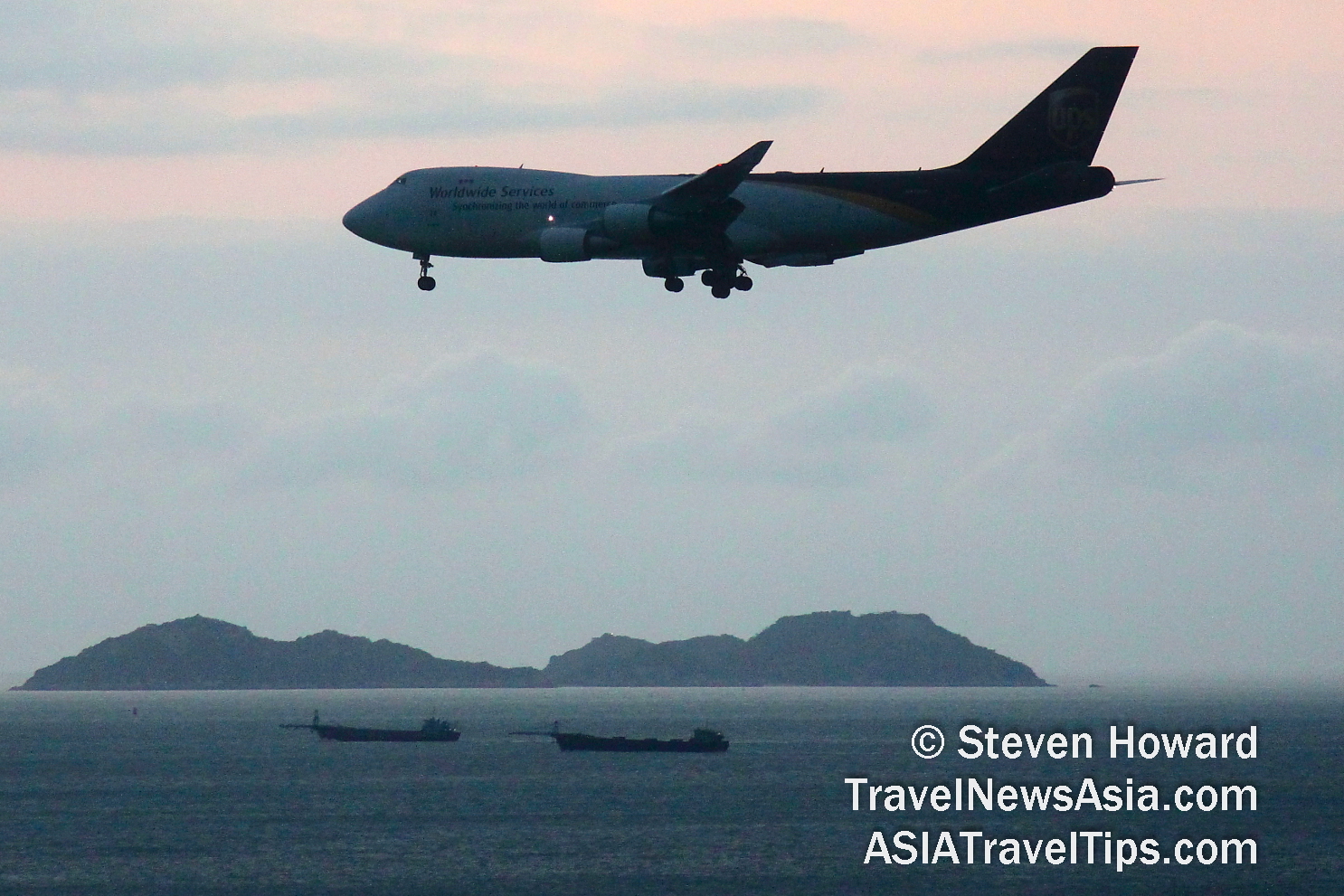 UPS Boeing 747 Freighter coming in to land at Hong Kong Airport (HKG). Picture by Steven Howard of TravelNewsAsia.com Click to enlarge.