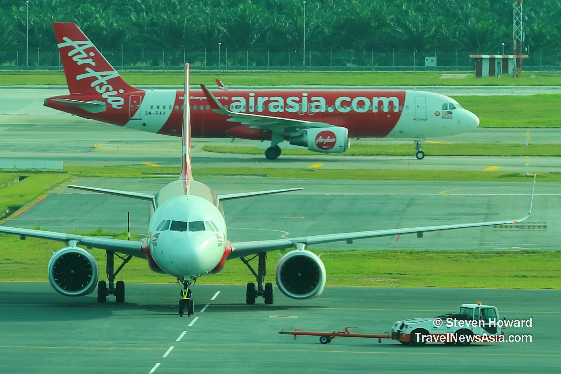 AirAsia Malaysia A320s at KUL. Picture by Steven Howard of TravelNewsAsia.com Click to enlarge.